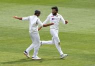 Ravindra Jadeja (R) celebrating with Ajinkya Rahane (L) after dismissing Matthew Wade